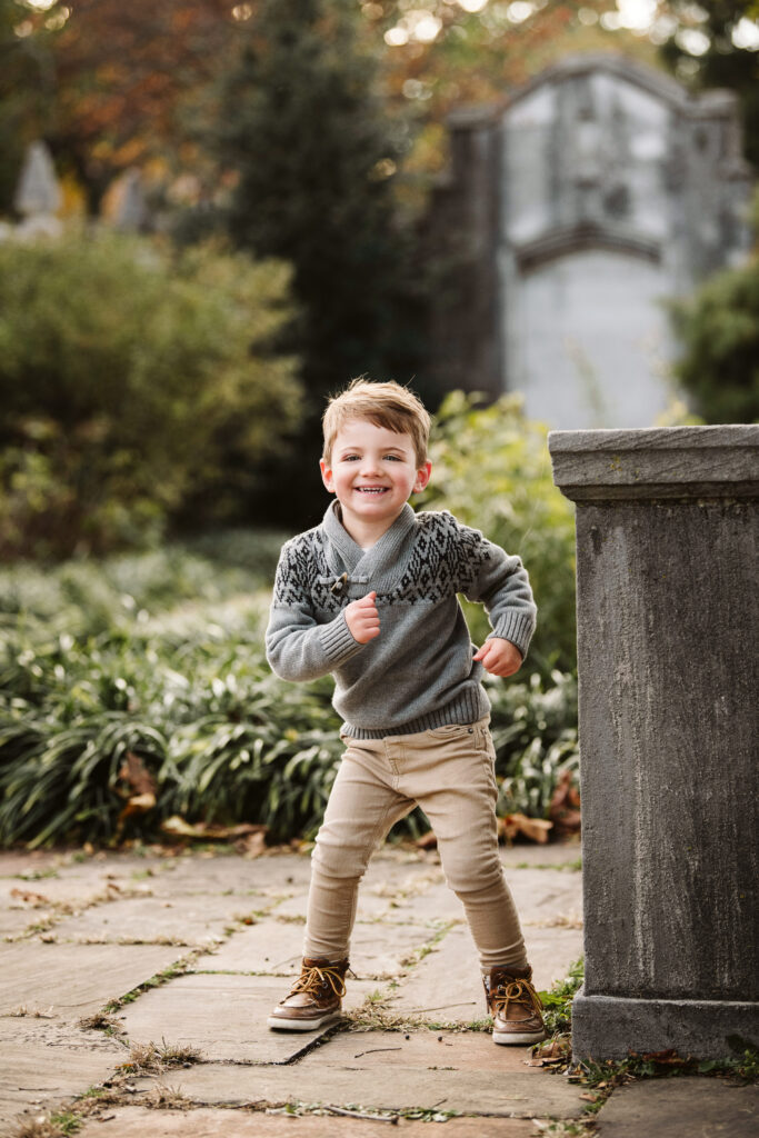 young child dancing during a Family photoshoot in Mellon Park