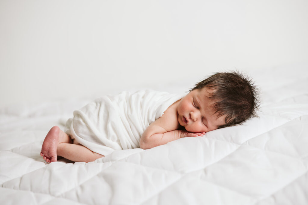 natural newborn portrait in modern white studio