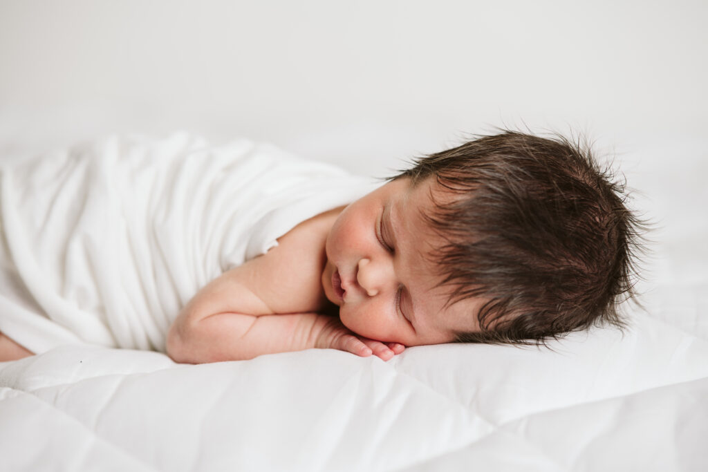 natural newborn portrait in modern white studio