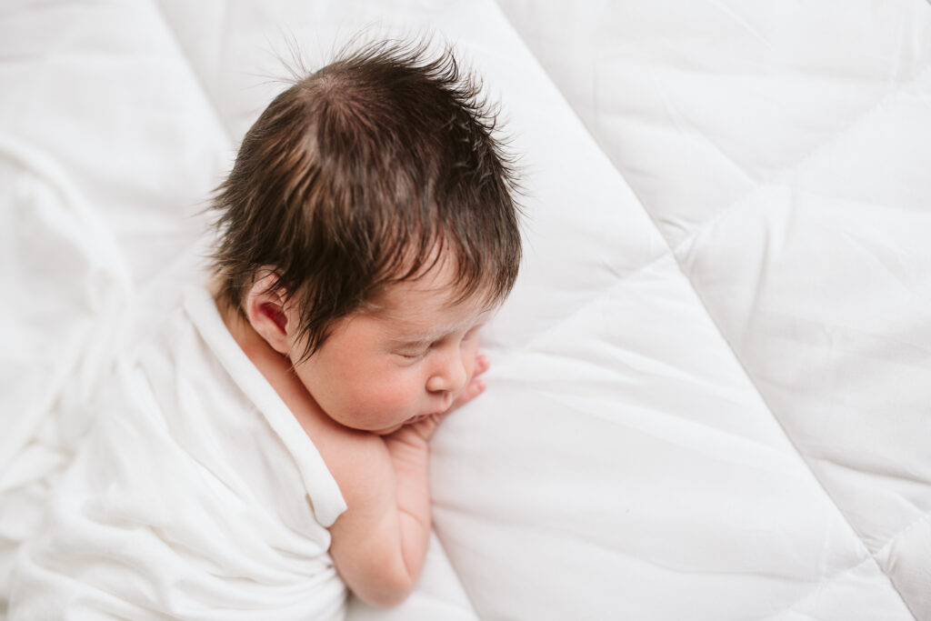 natural newborn portrait in modern white studio