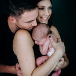 family with newborn in the studio. Photo by Laura Mares Photography, Pittsburgh Newborn Photographer.