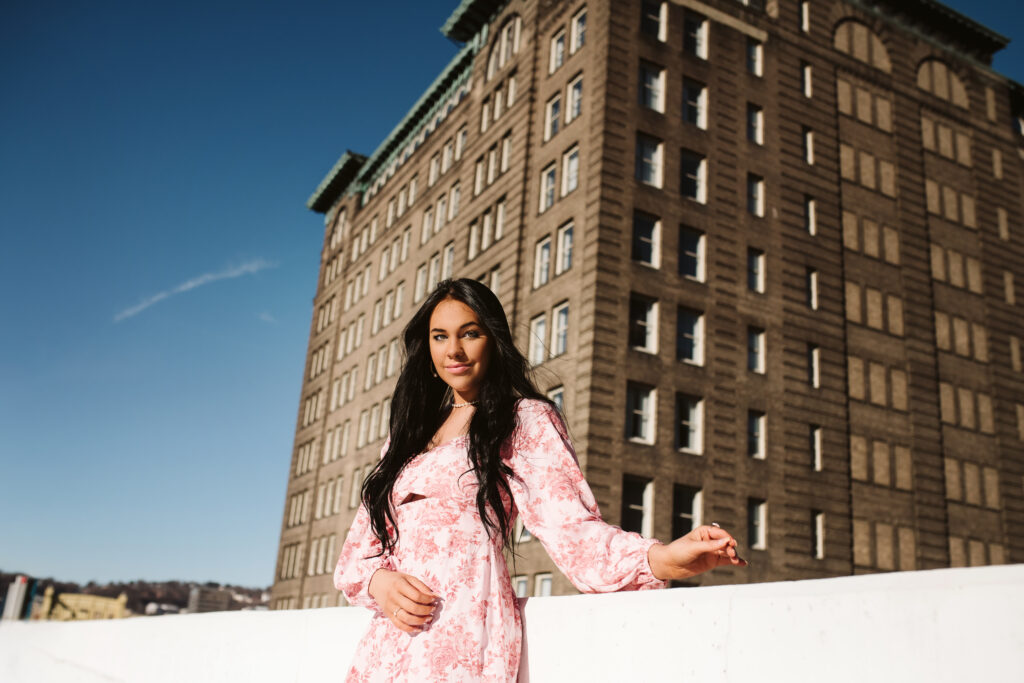 High School Senior portrait of a girl standing on a parking garage in downtown Pittsburgh, PA