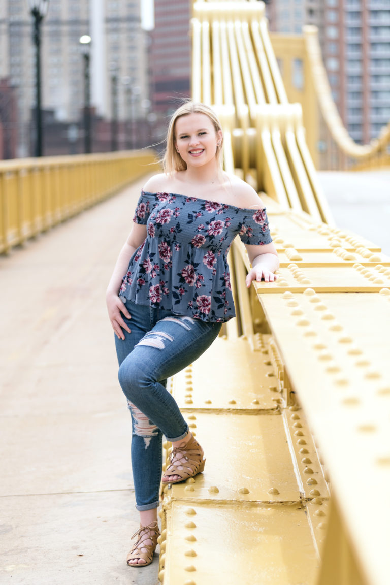senior girl standing on the Roberto Clemente Bridge near on the North Shore of Pittsburgh, photographed by Pittsburgh Photographer, Laura Mares Photography