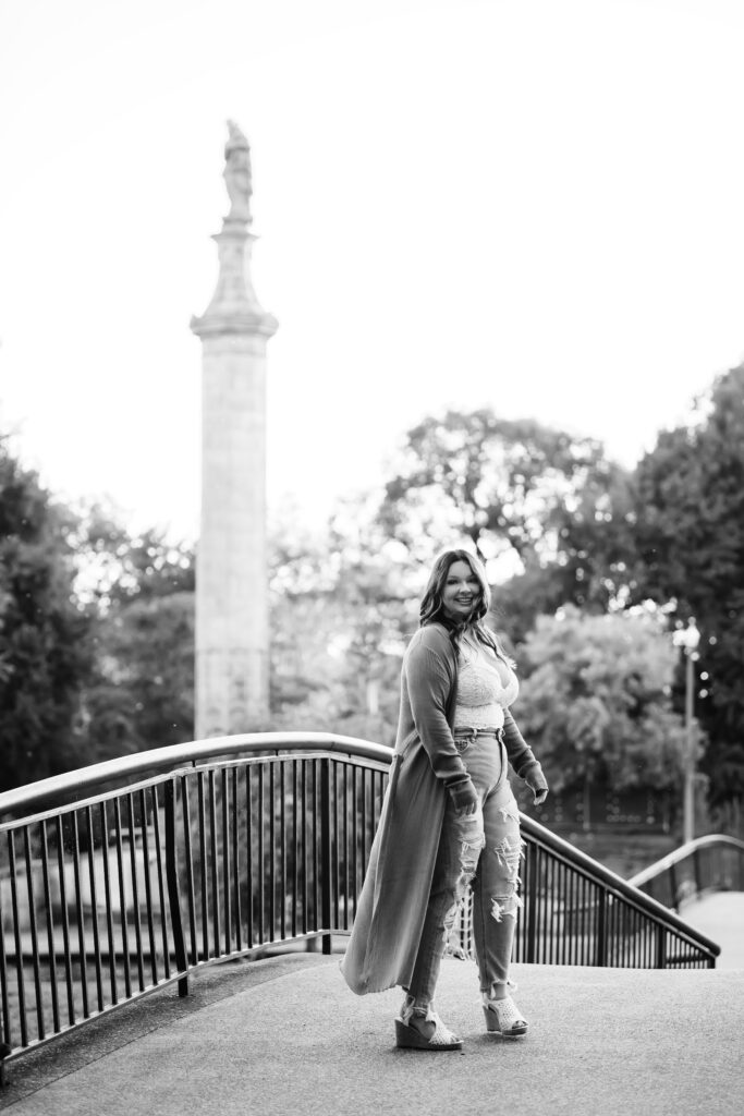 senior girl on a bridge during photo session