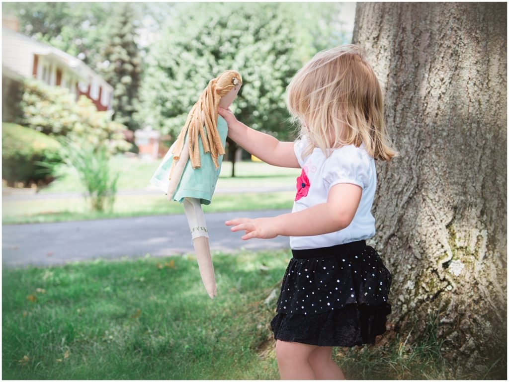 Ella holding her beloved doll, tutu. Photo by Laura Mares Photography, Pittsburgh Lifestyle Photographer