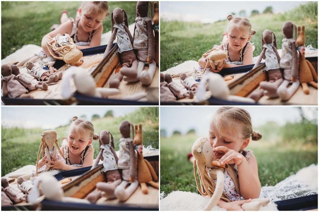 Ella playing with her favorite doll named Tutu. Photo by Laura Mares, a Pittsburgh Child Photographer.