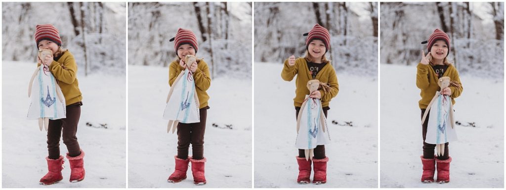 A girl with her doll standing in the snow. Photo by Laura Mares, Pittsburgh Lifestyle Photographer