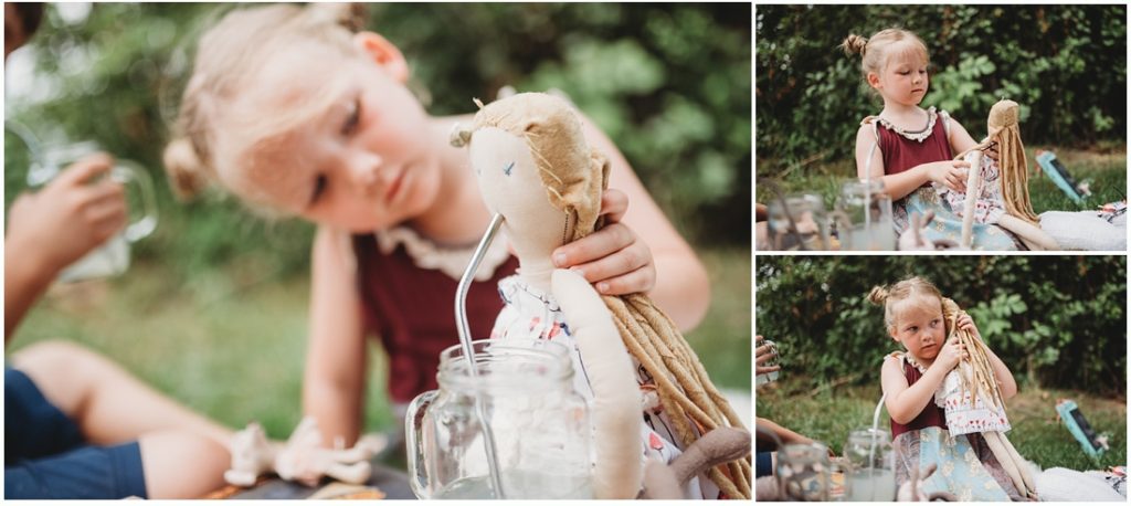 Ella playing and drinking lemonade with her favorite doll named Tutu. Photo by Laura Mares, a Pittsburgh Child Photographer.