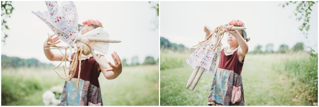 Ella playing with her favorite doll named Tutu. Photo by Laura Mares, a Pittsburgh Child Photographer.