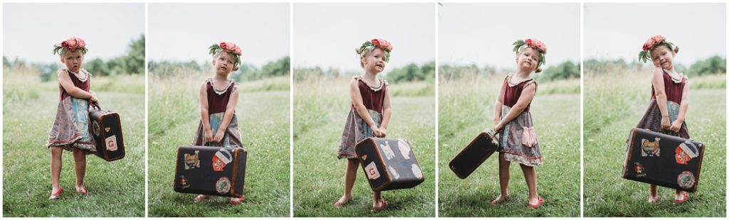 A girl holding a suitcase. Photo by Laura Mares, a Pittsburgh Child Photographer.