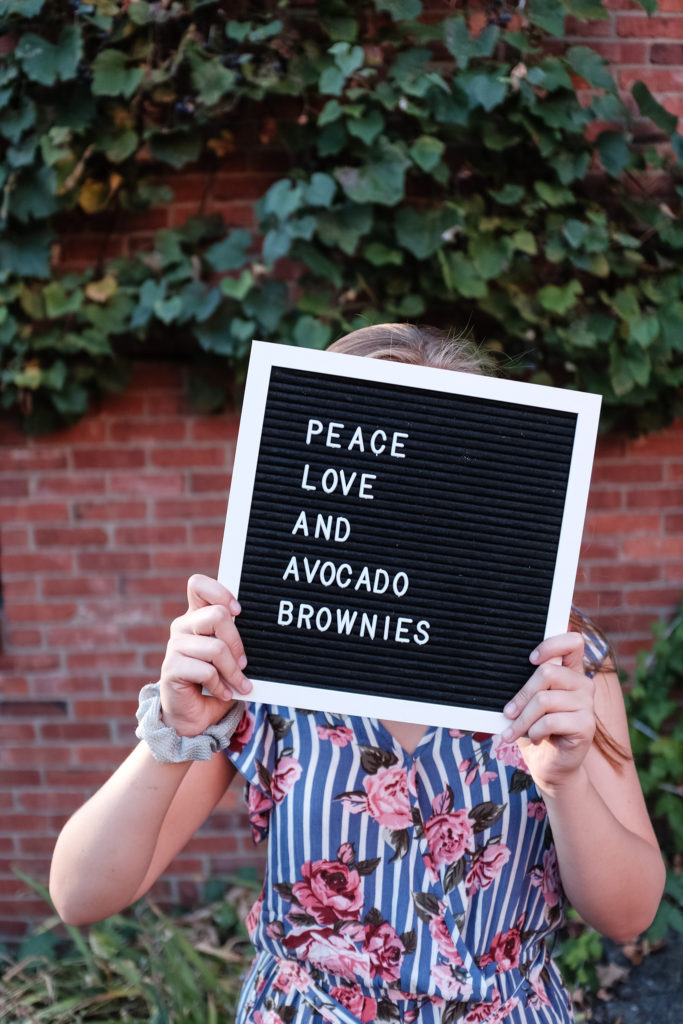Photograph of a sign board that reads" Peace, Love and Avocado Brownies" by Pittsburgh Lifestyle Photographer, Laura Mares Photography.