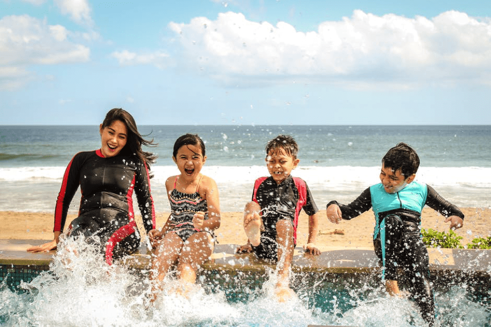 family splashing in the water