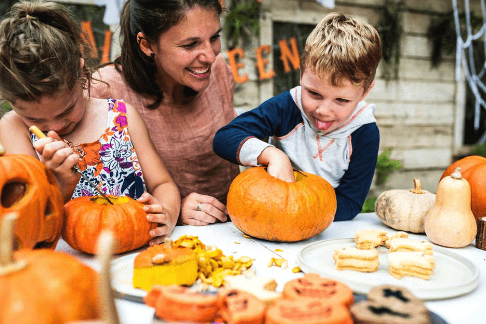 Family carving pumpkins