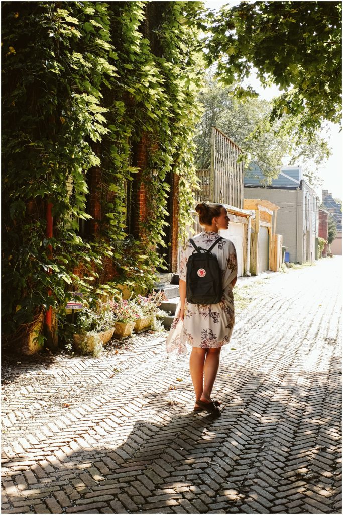 Girl walking on a brick street. Photo by Laura Mares Photography, Pittsburgh Senior Photographer.