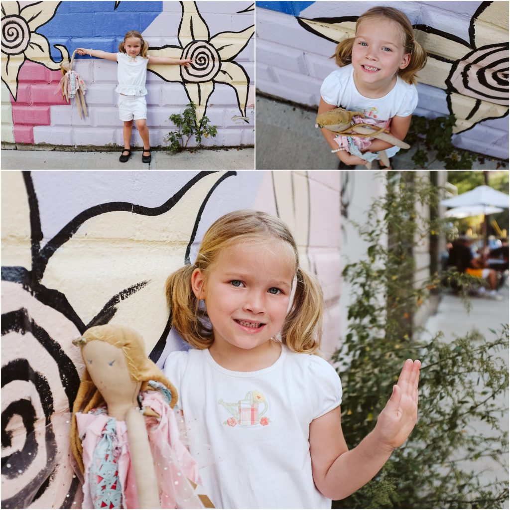 Girl standing in front of a painted mural. Photo by Laura Mares Photography, Pittsburgh Child Photographer.