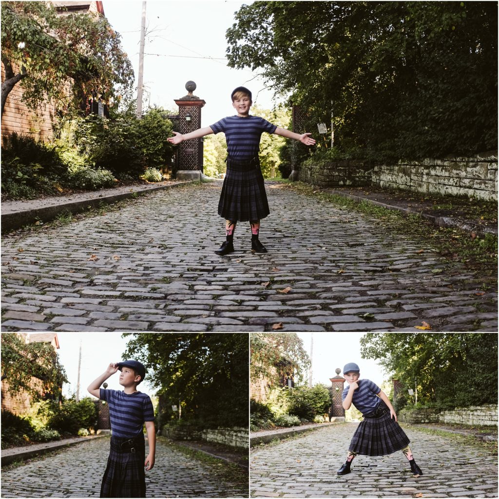 Boy standing on a cobblestone road wearing a kilt. Photo by Laura Mares Photography, Pittsburgh Child Photographer.