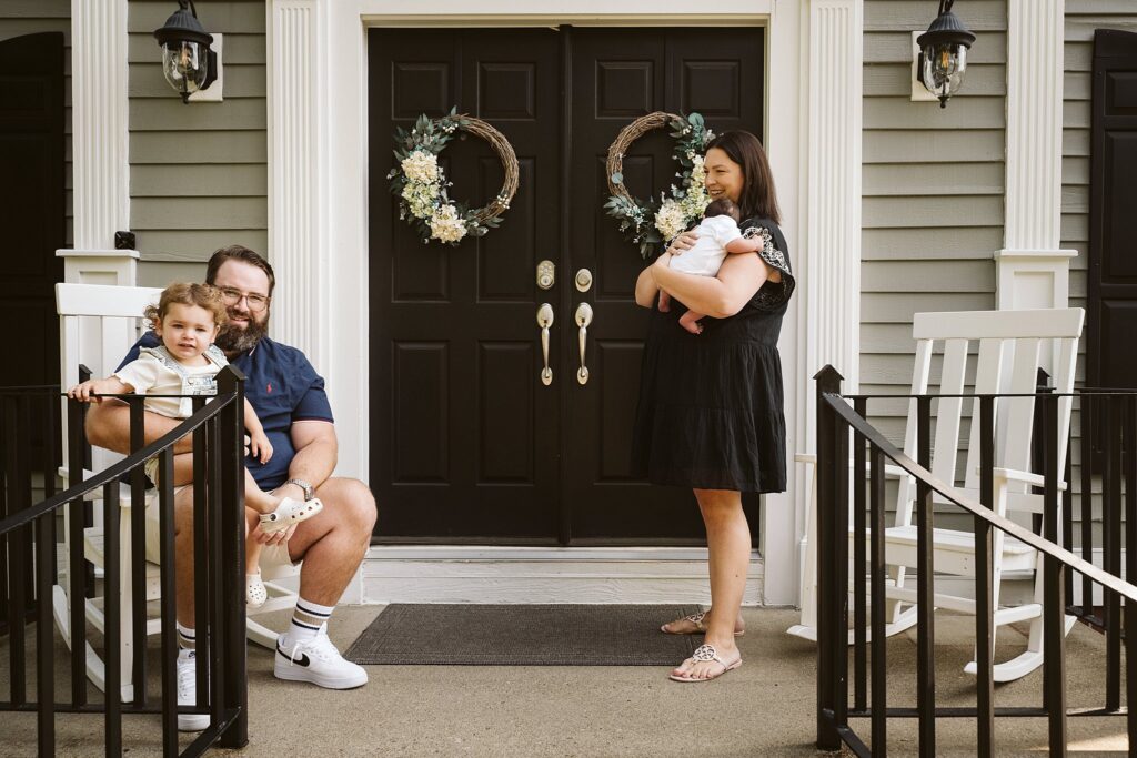 family on front porch durning newborn lifestyle session