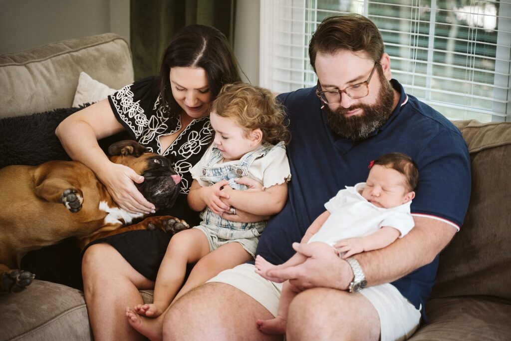 family with dog at newborn lifestyle session