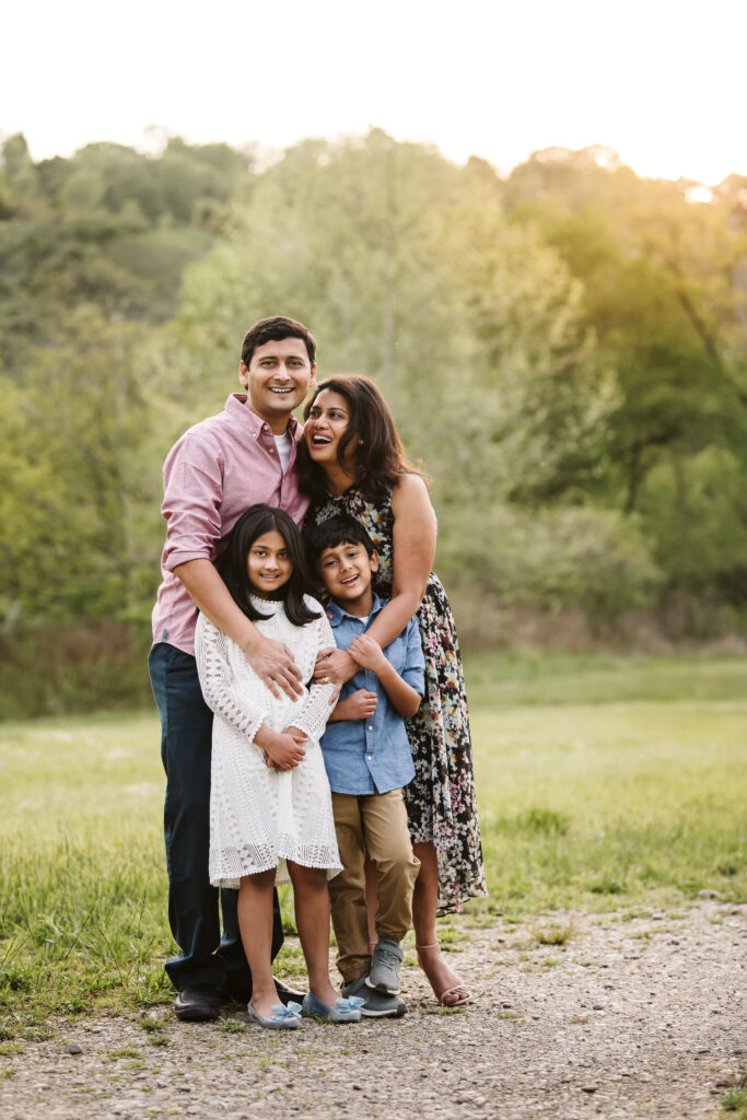 family laughing during photoshoot near Pittsburgh