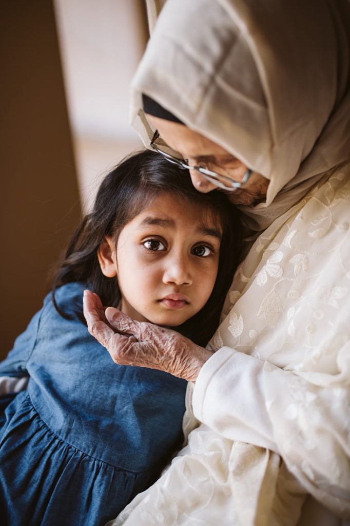 A tender lifestyle image of a great grandmother with her great granddaughter. Photo by Laura Mares Photography, Pittsburgh Lifestyle Photographer.