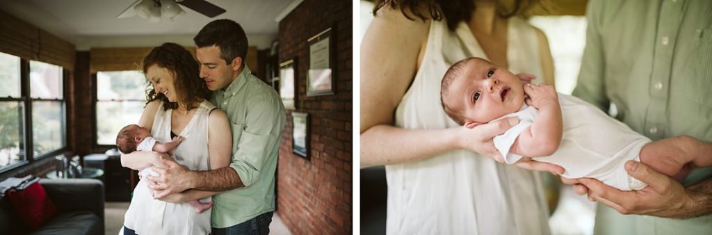 Lifestyle portrait of a family holding newborn baby in their living room | Photo by Laura Mares Photography, Pittsburgh Lifestyle Newborn Photographer
