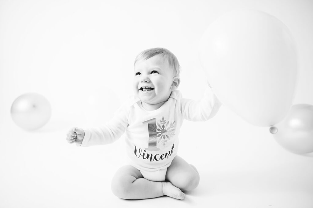 Black and white portrait of a 1st birthday boy. Photo by Laura Mares Photography, Pittsburgh Baby Photographer.