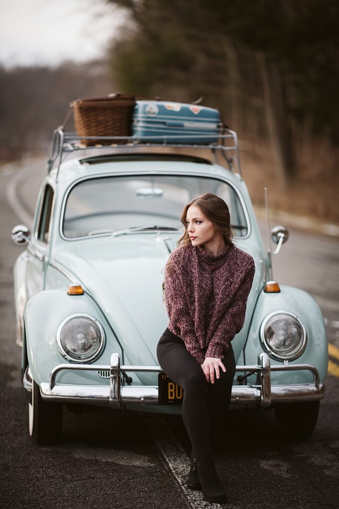 Senior girl posing for senior portrait with a VW Bug. Photo by Laura Mares Photography, Pittsburgh Senior Portrait Photographer.