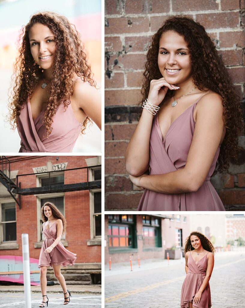 High school senior girl posing for senior photos in a pink dress in downtown pittsburgh