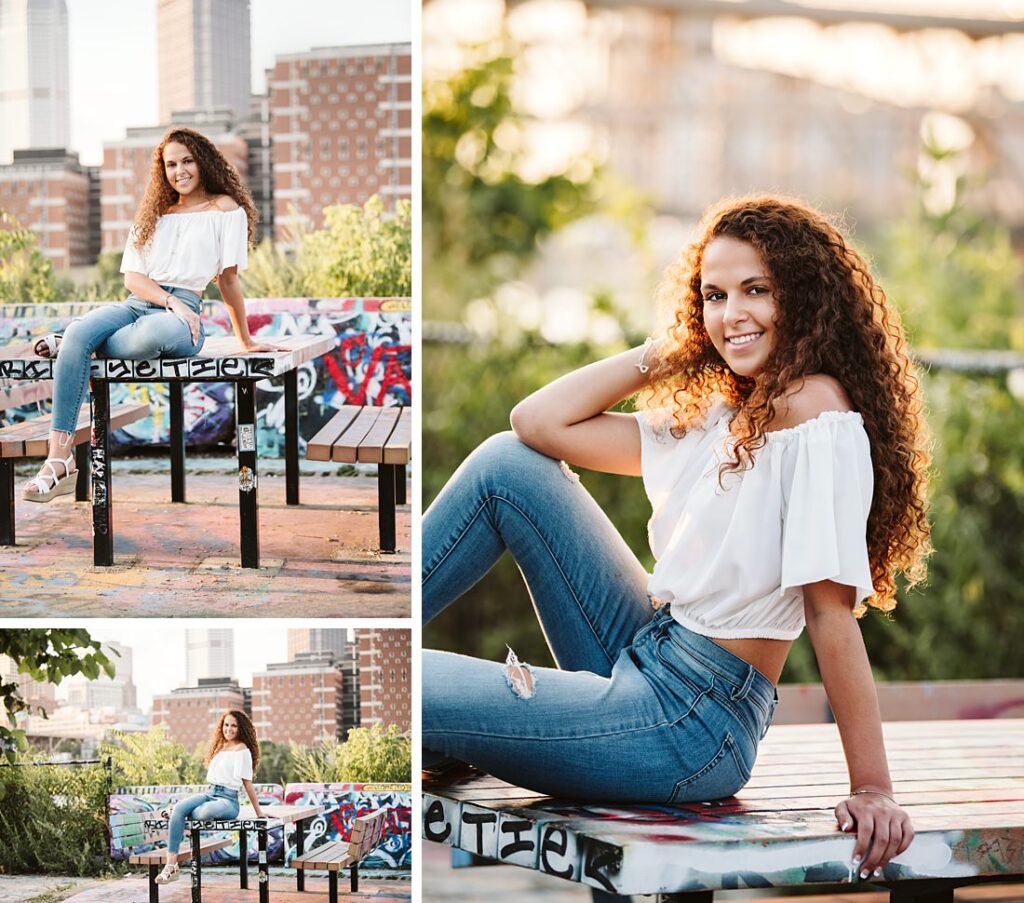 High school senior girl posing for senior photos in color park in downtown pittsburgh