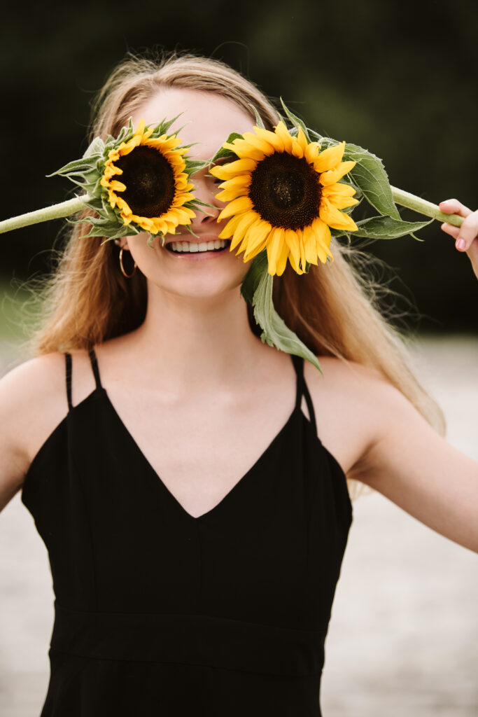 high school senior girl portrait with sunflowers at Hartwood Mansion, Pittsburgh