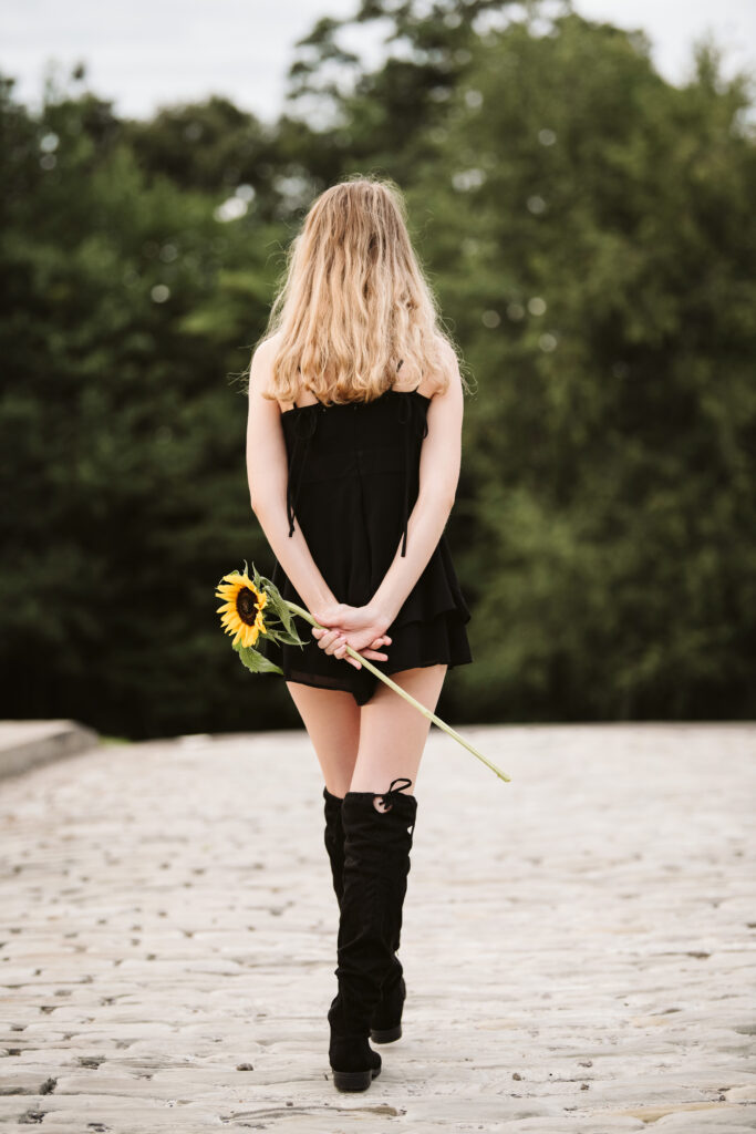 high school senior girl portrait with sunflowers at Hartwood Mansion, Pittsburgh
