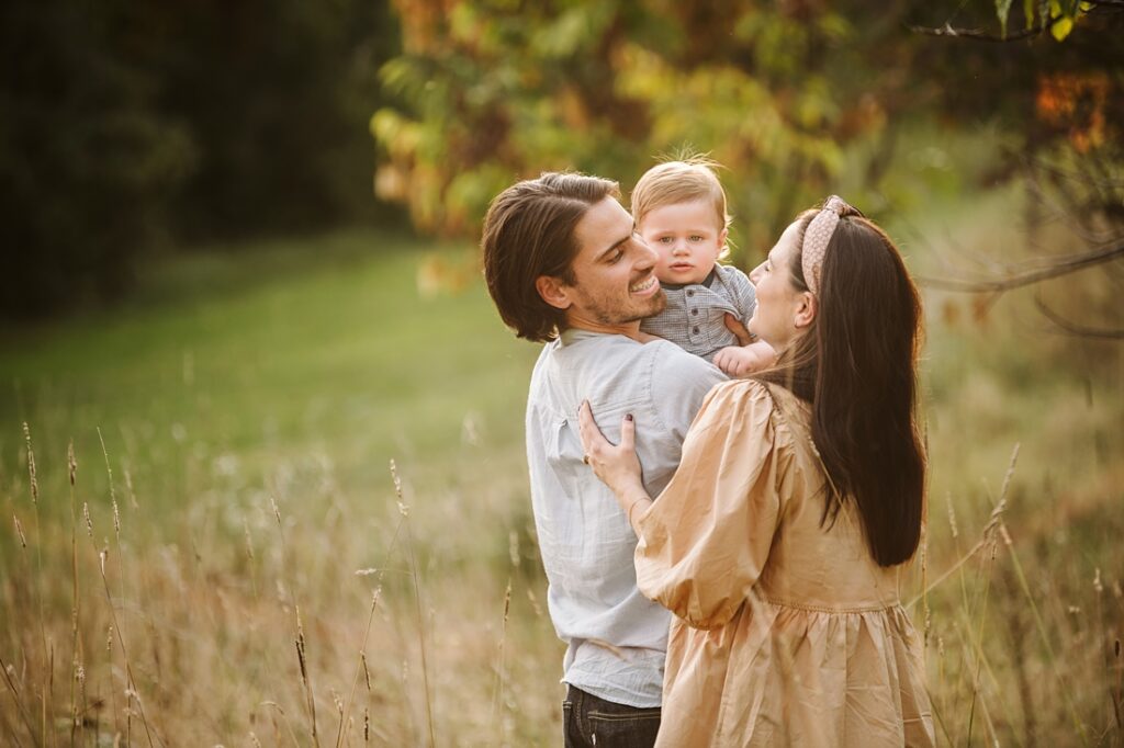 Family hugging during golden hour for a family photo session near Pittsburgh, PA