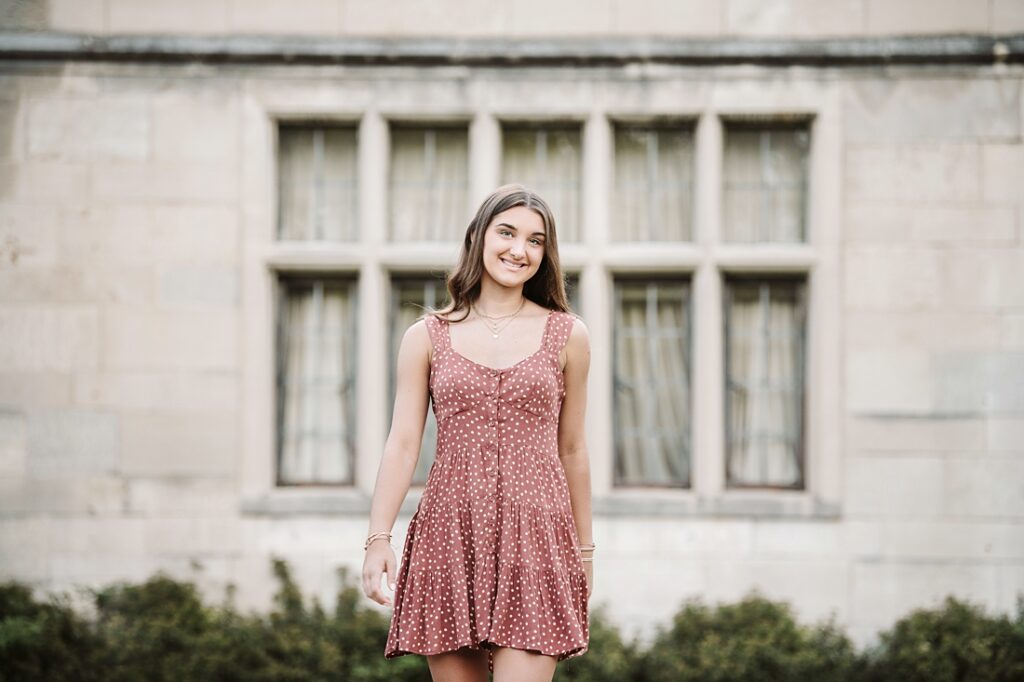 girl posing for senior pictures at Hartwood Acres