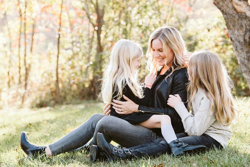 picture of a mother and daughters at sunset