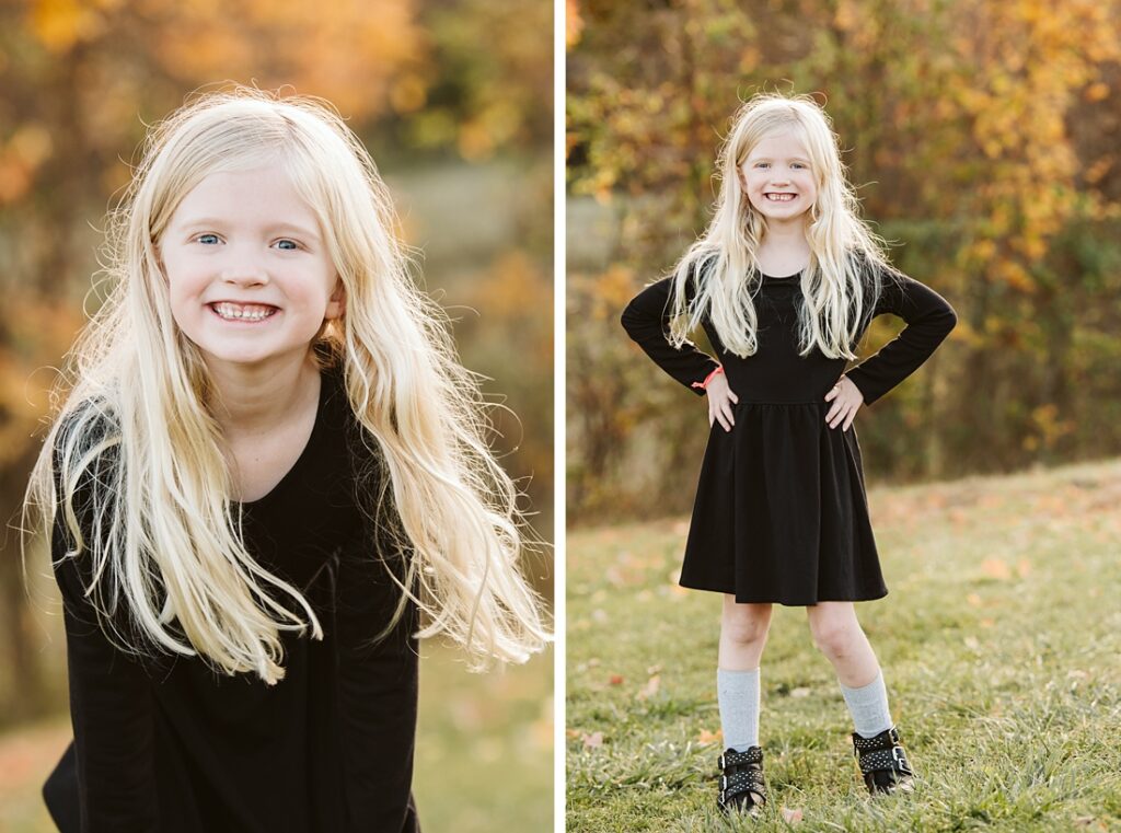 a young girl wearing a black dress laughing during a portrait session