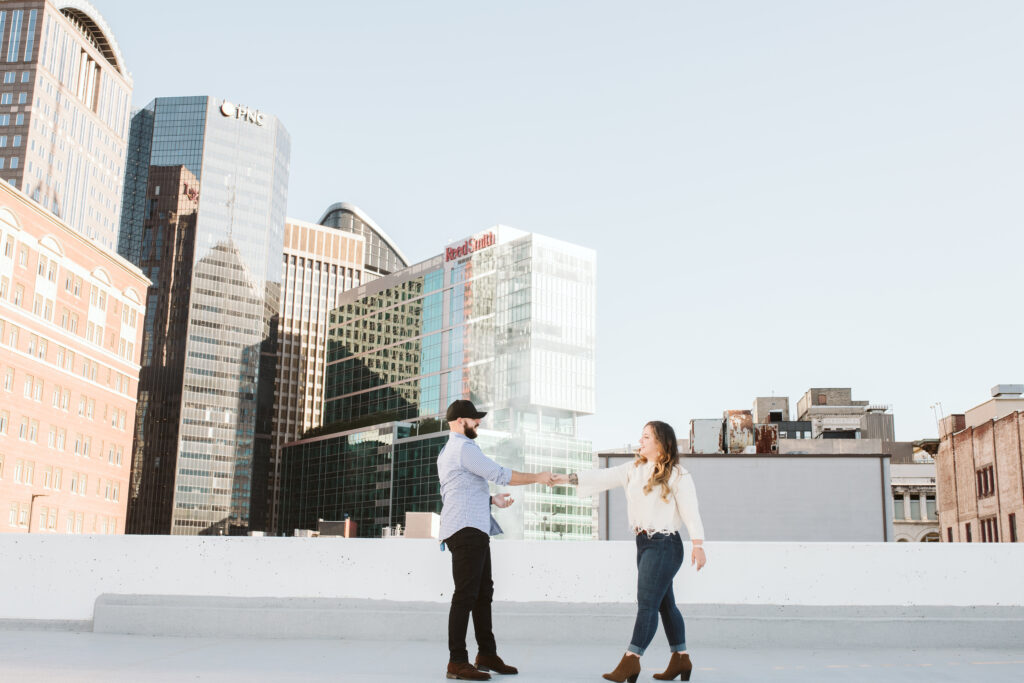 couple dancing on a garage rooftop in downtown Pittsburgh, PA