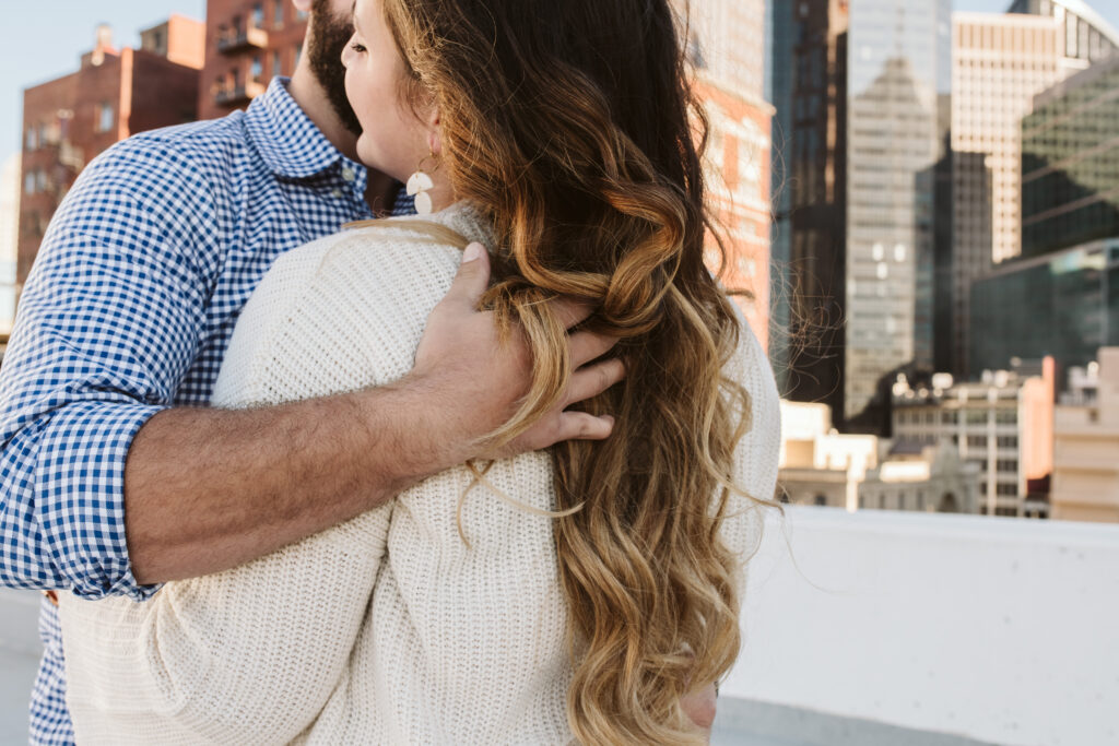 couple dancing on a garage rooftop downtown Pittsburgh