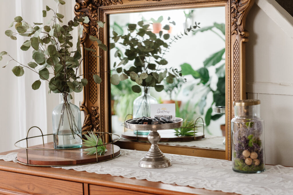 vintage mirror with greenery and dried flowers