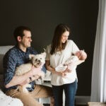 lifestyle newborn family picture with white dog with beautiful natural light