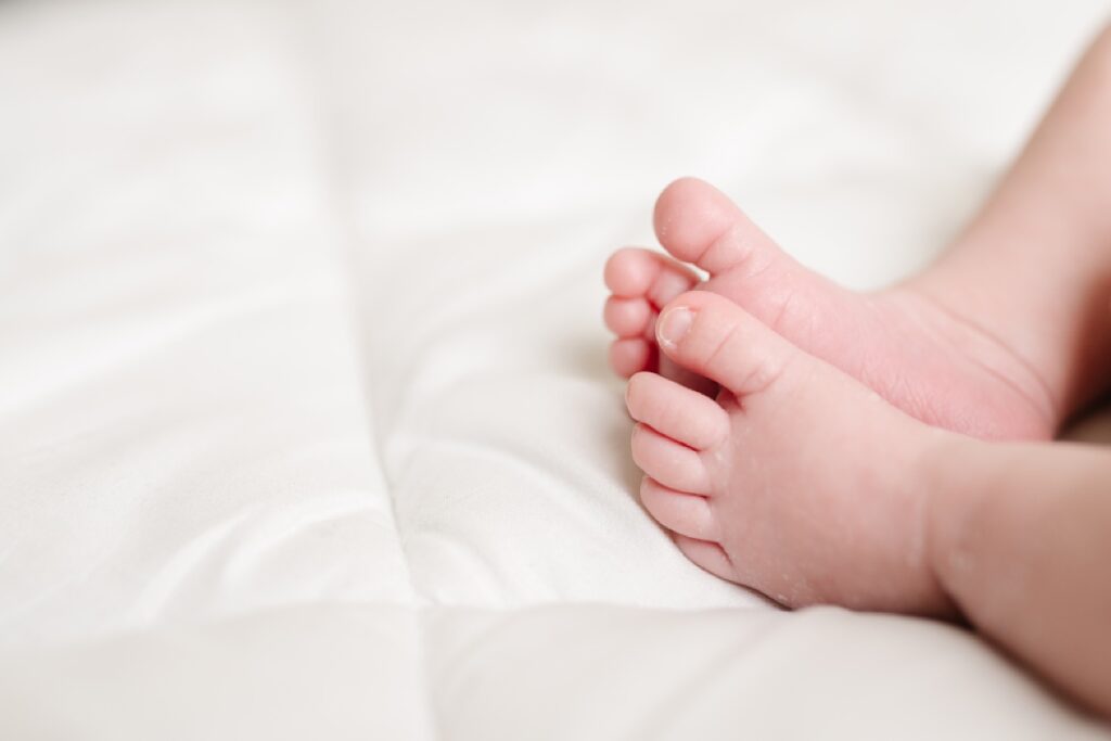 simple white studio newborn toes portrait