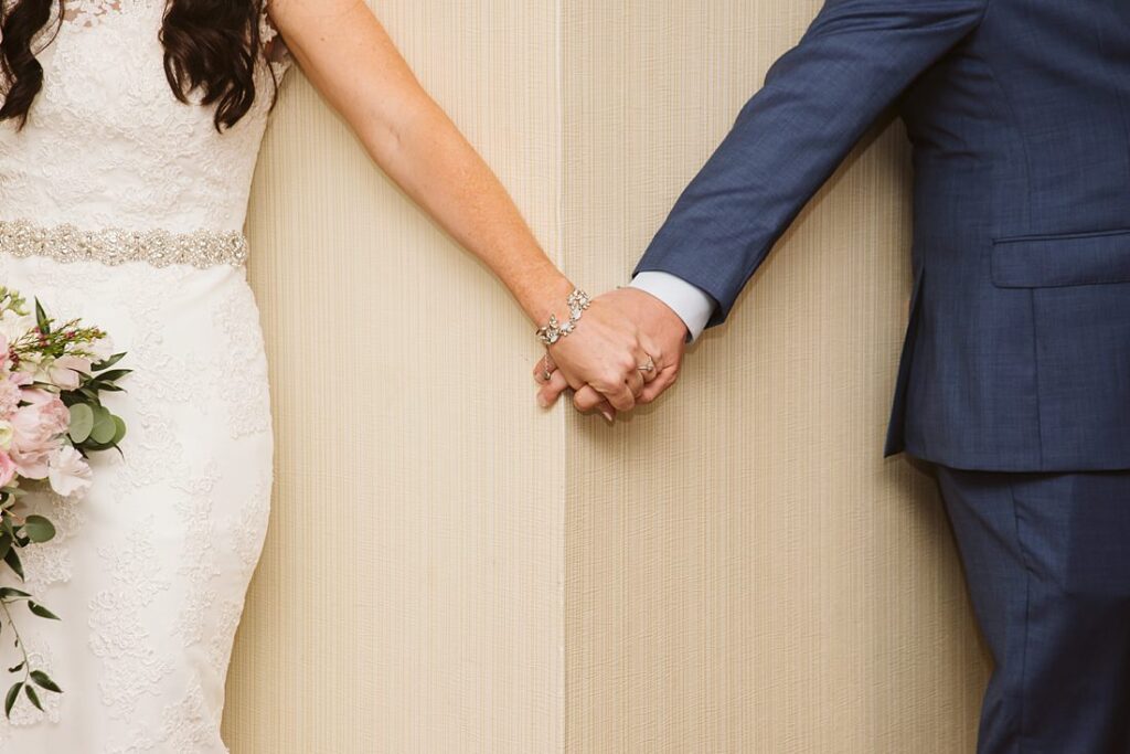 Bride and Groom holding hands before the wedding