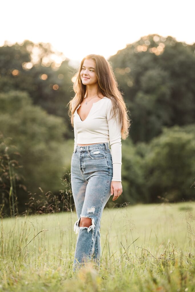 portrait of a senior girl in a rural field near Pittsburgh