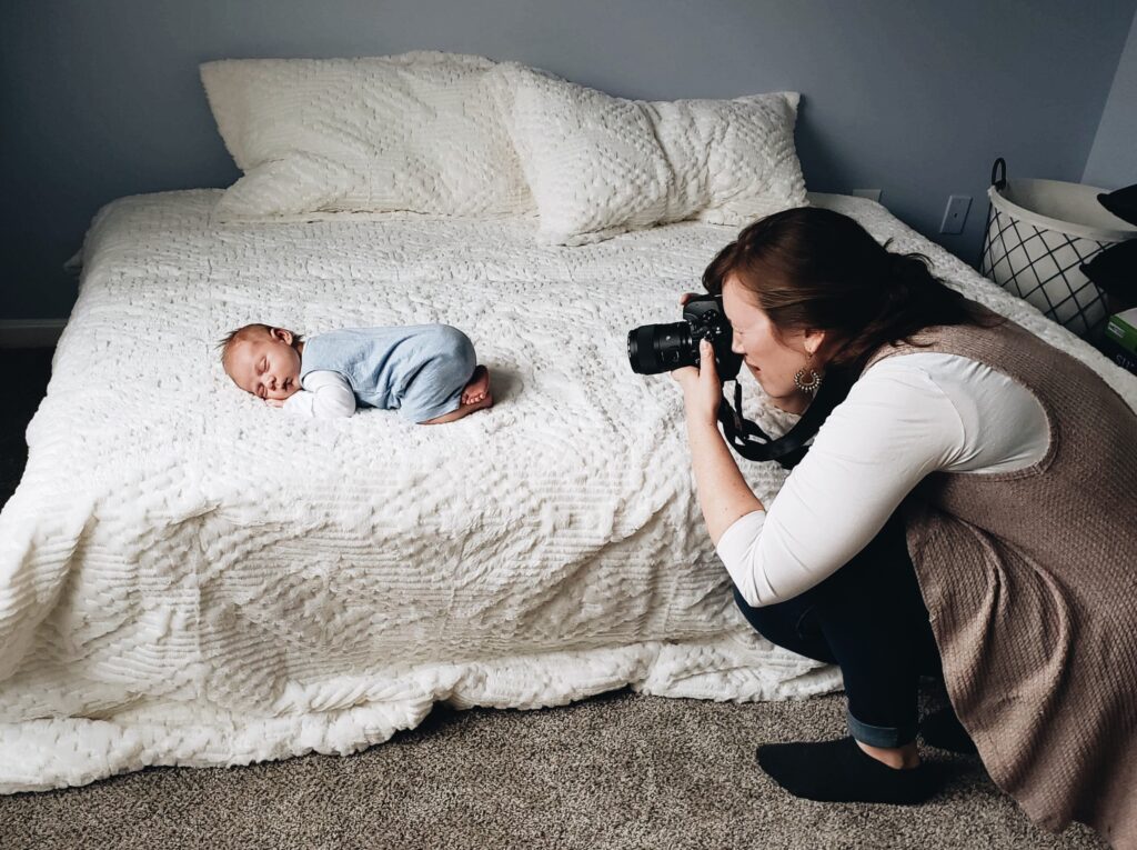 Pittsburgh newborn photographer, Laura Mares, photographing newborn baby