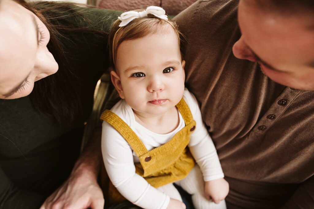 first birthday portrait of baby girl with parents