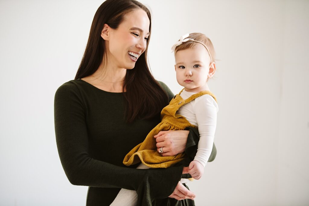 first birthday portrait of baby girl with mom