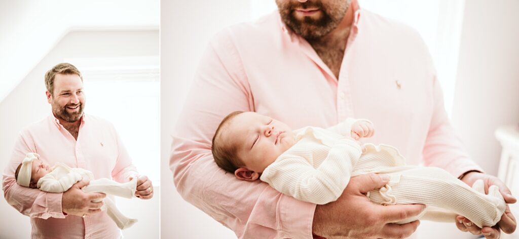 newborn lifestyle picture of a father holding baby near a window