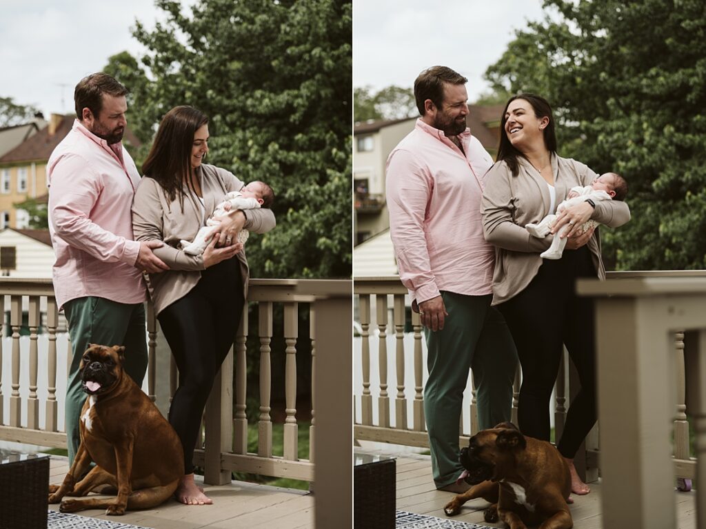 newborn lifestyle picture of family holding baby outside