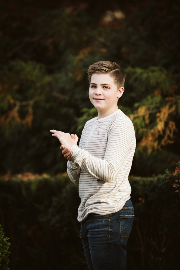 son standing during a portrait session in Pittsburgh's Mellon Park