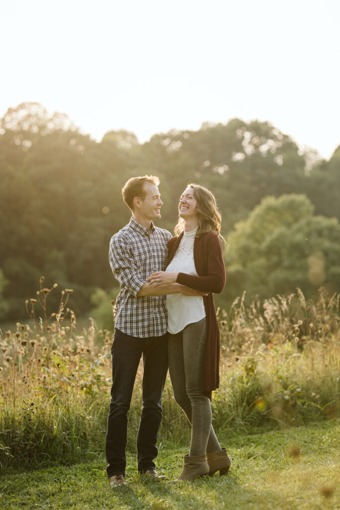 portrait of parents in a rural field at sunset near Pittsburgh, PA