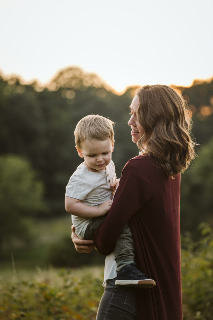 portrait of mother and son in a rural field at sunset near Pittsburgh, PA